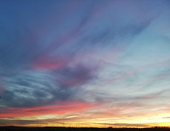 Low angle view of dramatic sky during sunset