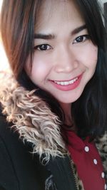 Portrait of smiling young woman