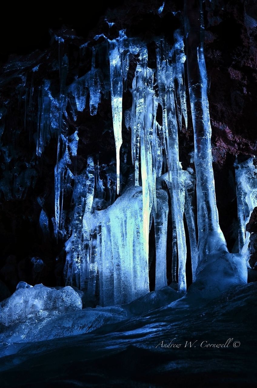 cold temperature, winter, snow, indoors, night, frozen, illuminated, no people, covering, ice, religion, spirituality, white color, in a row, icicle, season, wood - material, close-up