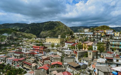 High angle view of townscape against cloudy sky