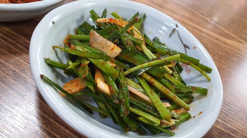 High angle view of vegetables in plate on table