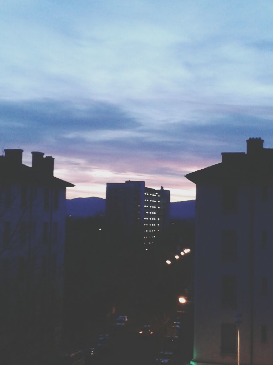 building exterior, architecture, built structure, sunset, city, sky, cloud - sky, silhouette, building, residential building, cityscape, residential structure, dusk, skyscraper, cloud, outdoors, no people, cloudy, city life, residential district