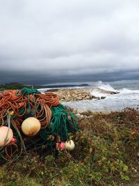 Scenic view of sea against cloudy sky