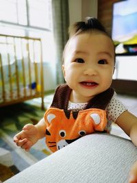 Portrait of cute smiling boy at home