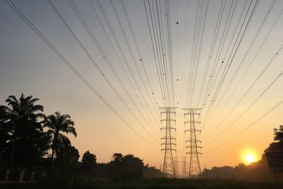 Low angle view of silhouette trees against sky during sunset