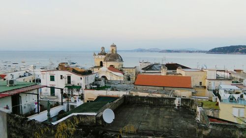 View of sea with buildings in background