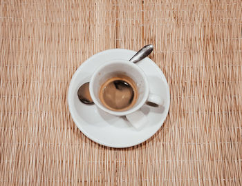 High angle view of coffee cup on table