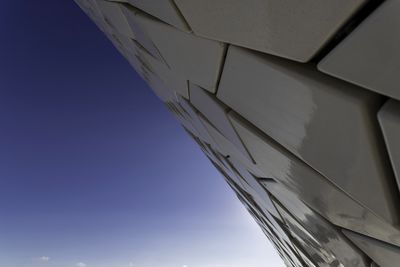 Low angle view of building against blue sky