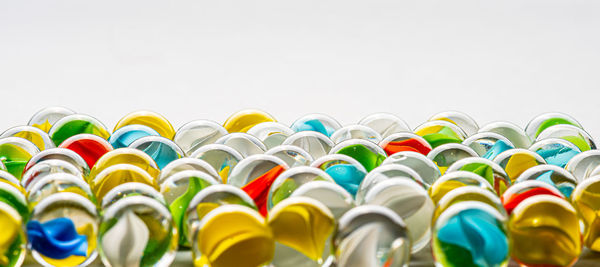 Close-up of multi colored pencils against white background