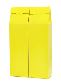 Close-up of yellow paper over white background