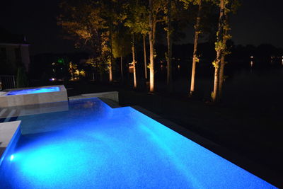 View of swimming pool at night