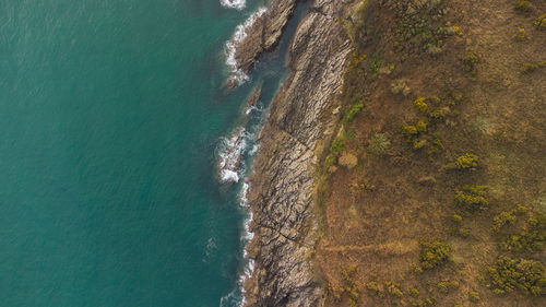 High angle view of rock formation on beach