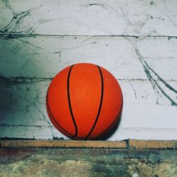 Close-up of basketball against wall
