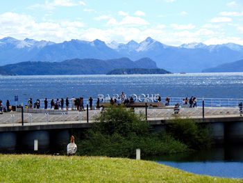 Scenic view of sea and mountains against sky