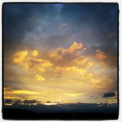 Scenic view of landscape against cloudy sky