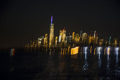 Illuminated buildings in city at night