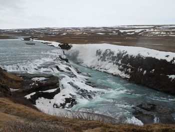 Scenic view of frozen sea against sky