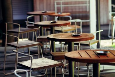 Empty chairs and table in cafe