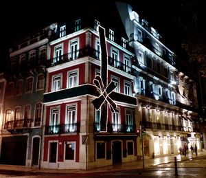 Buildings in city at night