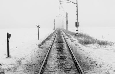 Railroad track against clear sky