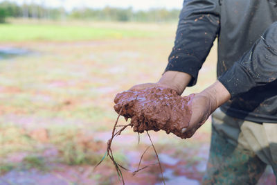 Midsection of man working in park