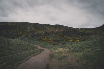 Road by land against sky