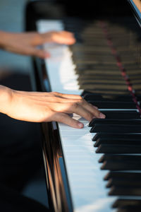 Cropped image of pianist playing piano