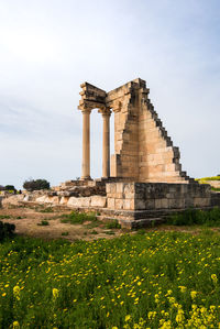 Old ruin on field against sky