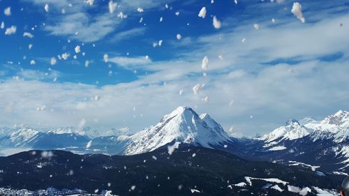 Scenic view of snowcapped mountains against sky