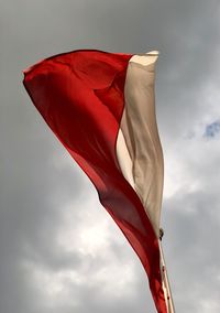Low angle view of polish flag against sky