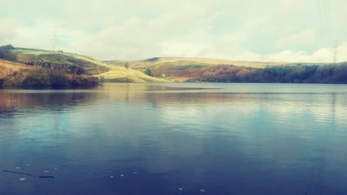 Scenic view of lake with mountains in background