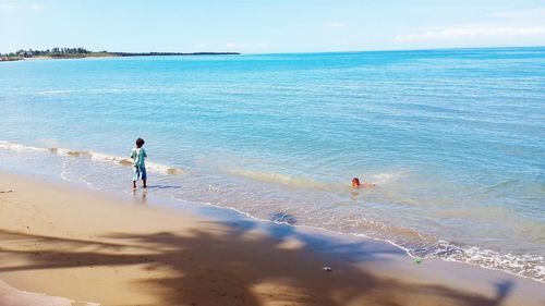 High angle view of boys playing at beach