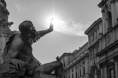 Low angle view of statue against sky