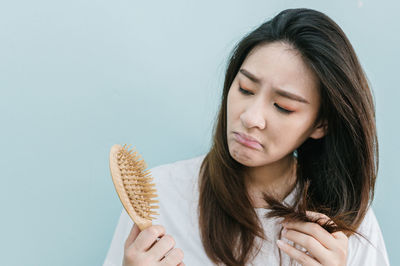 Portrait of a beautiful young woman over white background