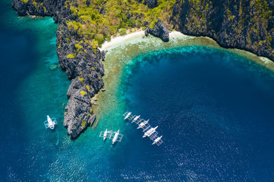 High angle view of umbrella by sea