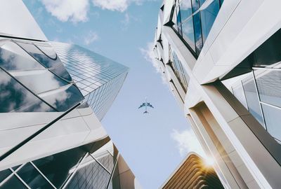 Low angle view of airplane flying in sky