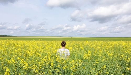 Rear view of person in field