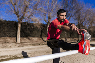 Athlete stretching outdoors