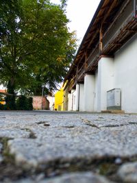 Surface level of street amidst buildings against sky