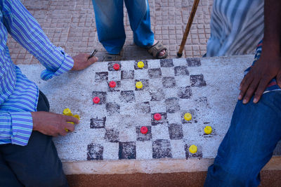 Low section of man standing on carpet