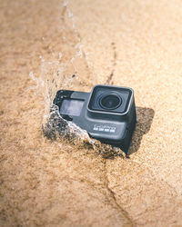 High angle view of camera on sand