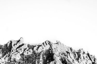 Scenic view of snowcapped mountains against clear sky