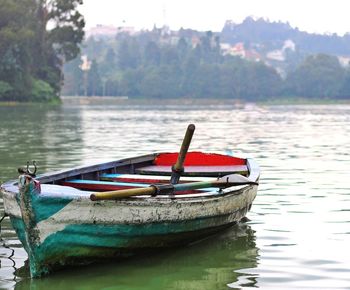 Boat moored in lake