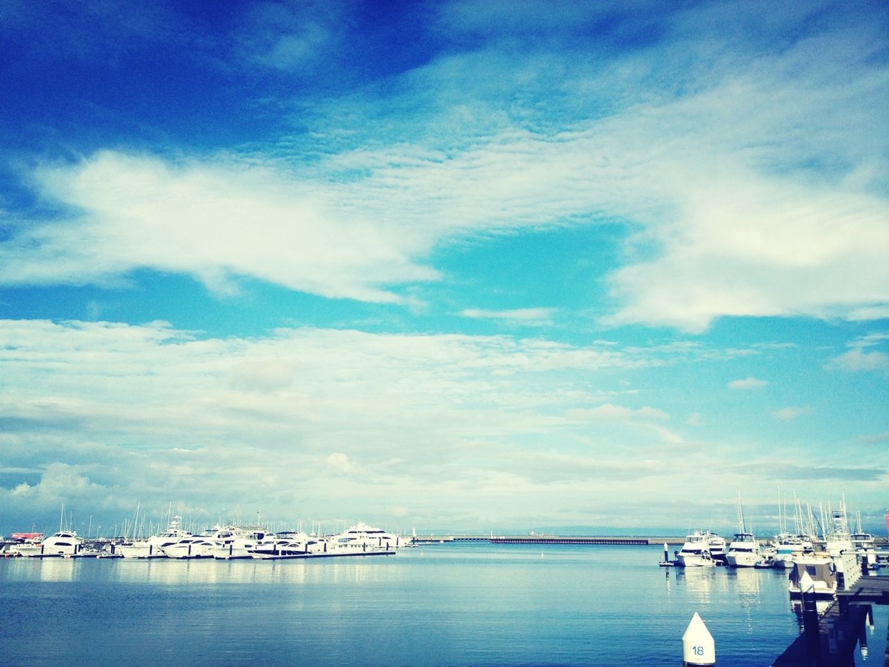 nautical vessel, water, transportation, mode of transport, sky, boat, moored, sea, waterfront, harbor, cloud - sky, blue, sailboat, mast, cloud, nature, marina, tranquility, tranquil scene, cloudy