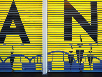 Closed yellow shutters on shop