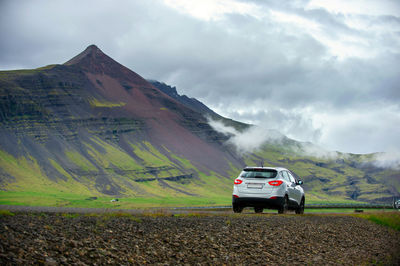 Cars on road against sky