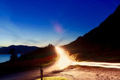 Scenic view of road against sky during sunset