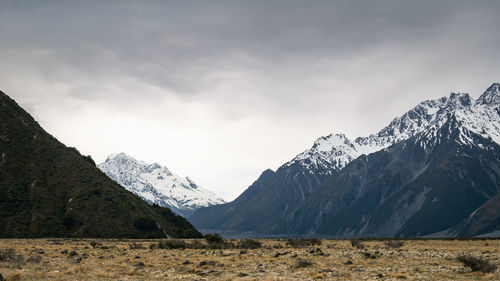 Alpine valley during approaching storm with peaks covered by snow,aoraki mt cook n.park, new zealand