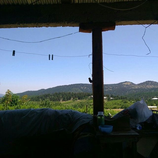 mountain, clear sky, power line, landscape, mountain range, tranquility, cable, built structure, house, nature, sky, tranquil scene, day, hanging, electricity pylon, indoors, no people, architecture, electricity, low angle view