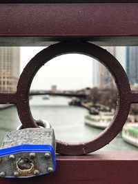 Close-up of metal chain on river